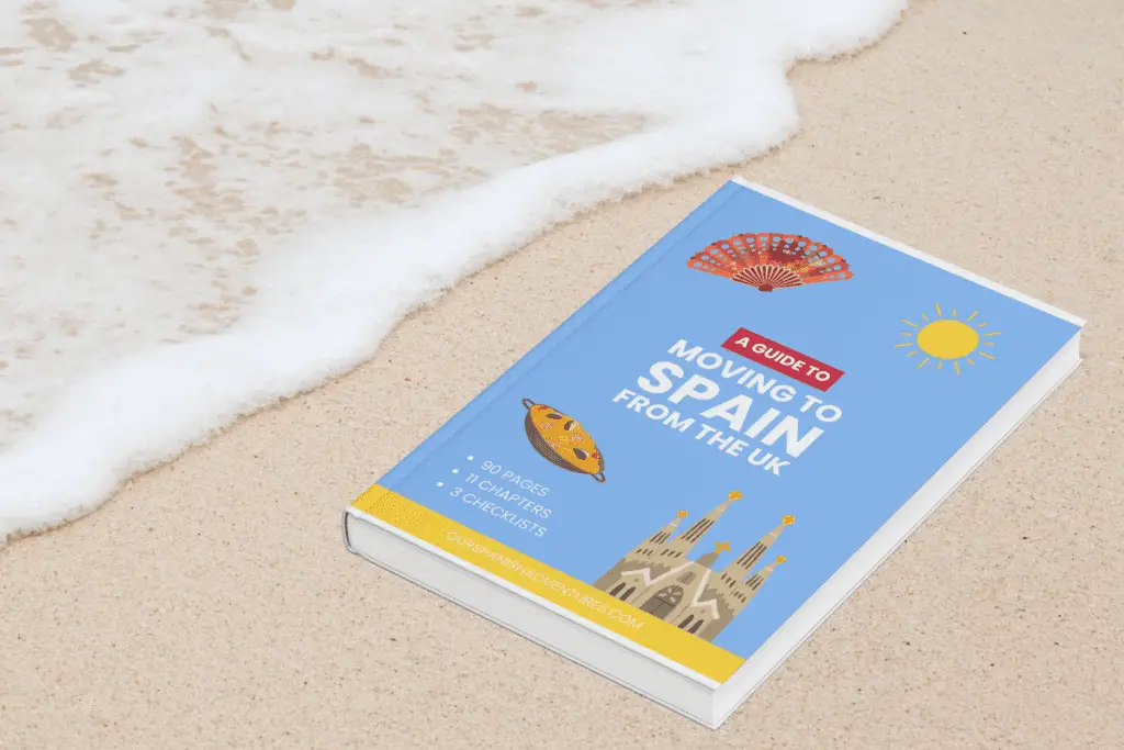 Guide moving to Spain book on sandy beach