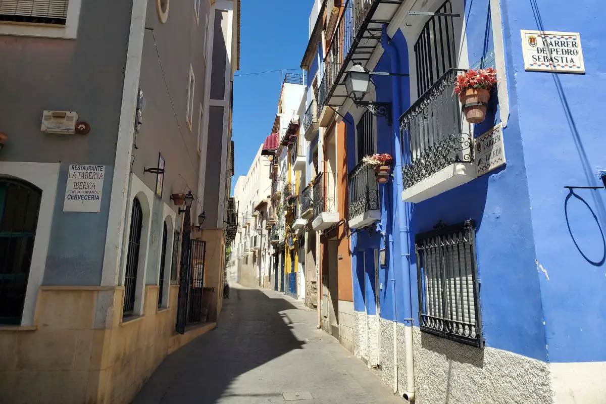A colourful narrow street in Alicante's old town.