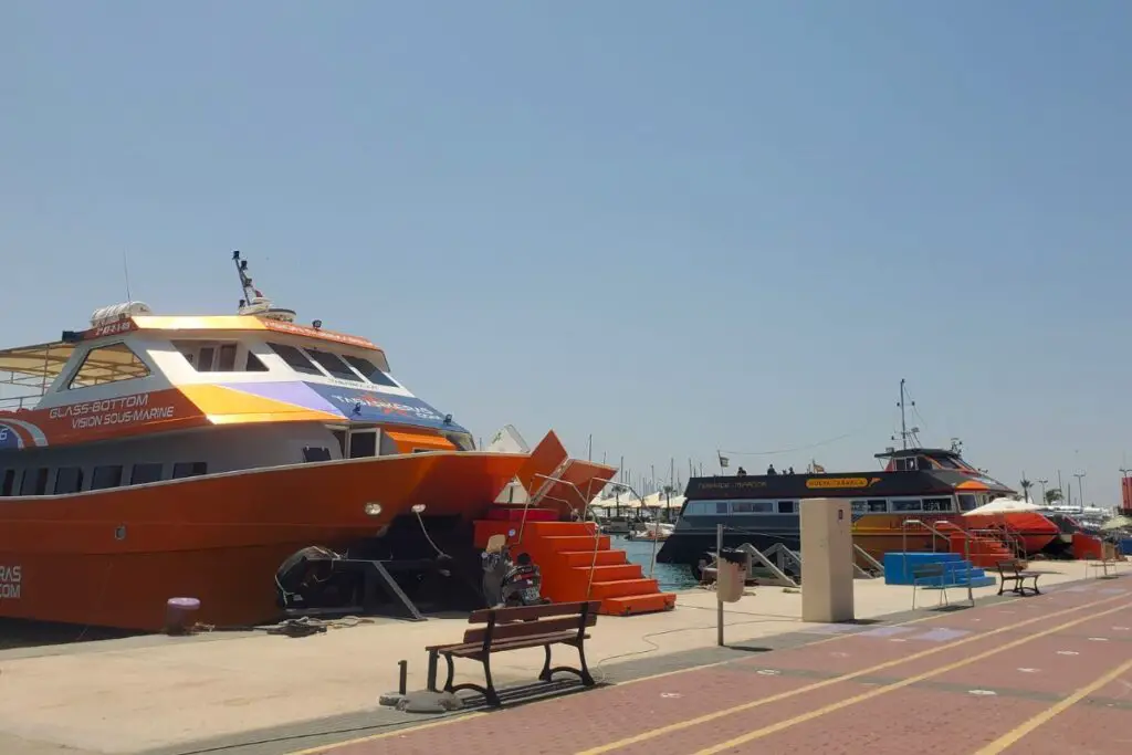 santa pola boats to tabarca Orange, red and white ferry boats lined up in the harbour to go to Tabarca Island