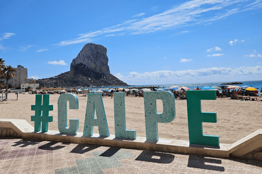 calpe sign and beach Calpe sign in front of beach and Peñon de Ifach